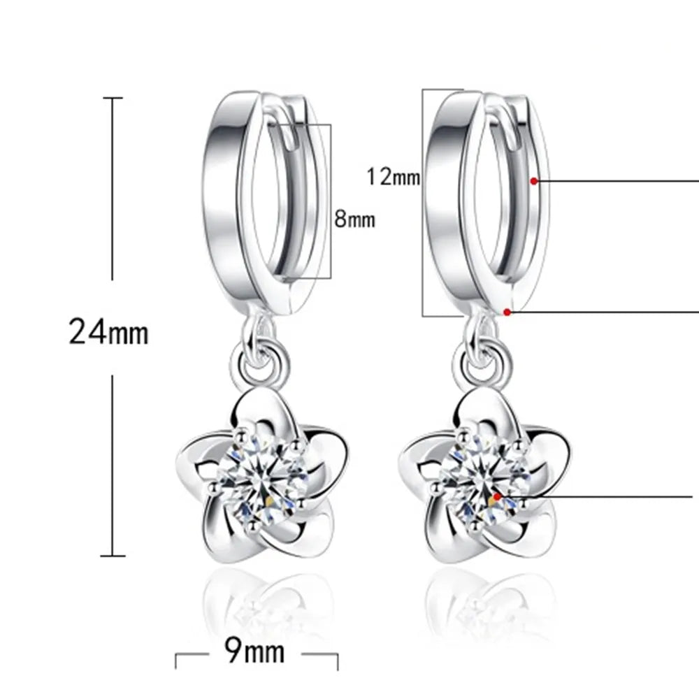 Boucles d'oreilles en argent avec des zircons violets et blancs