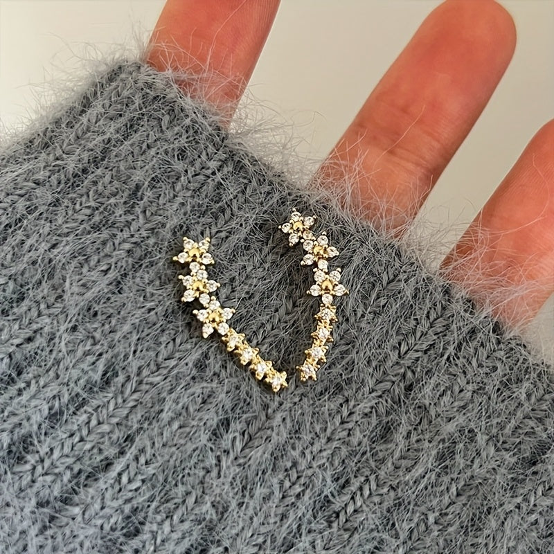 Des boucles d'oreilles fleuries intemporelles