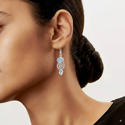 Boucles d'oreilles vintage en argent ornées de pierre de lune