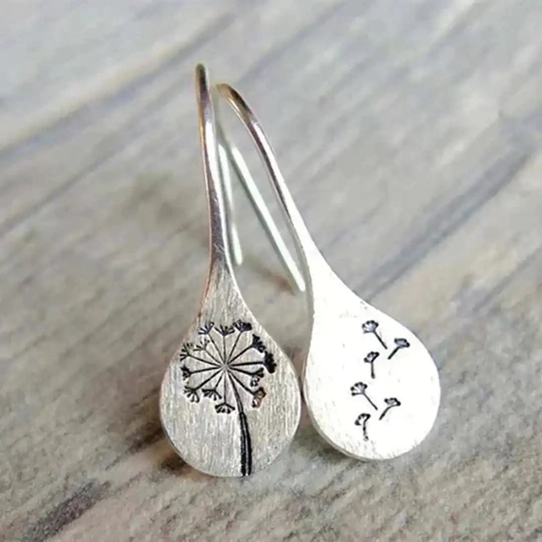 Boucles d'oreilles vintage en argent, délicatement sculptées en forme de fleur